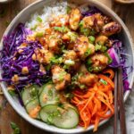 Bang bang chicken bowls with rice and vegetables.
