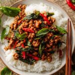 Thai Basil Chicken served over steamed rice.