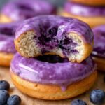 Here’s a delicious image of blueberry cake donuts with vibrant purple glaze, perfect for a sweet treat