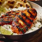 grilled tandoori chicken served over rice with lime.